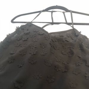Black semi sheer camisole with small daisy emblems